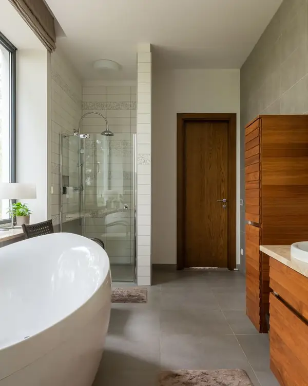 A finished modern bathroom with a walk in shower