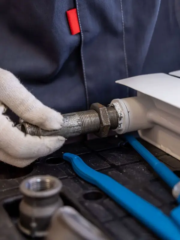 Plumber fitting a radiator pipe