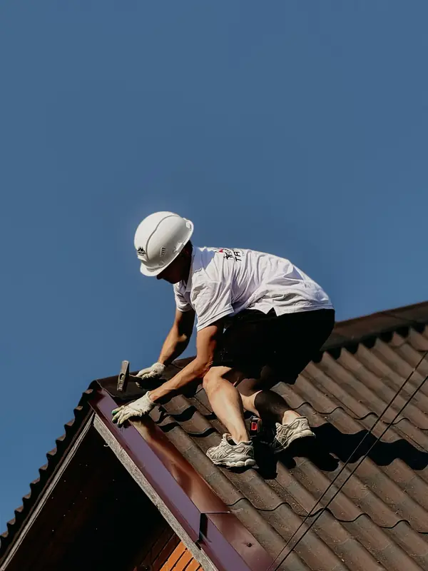 Roofer working on a tiled roof